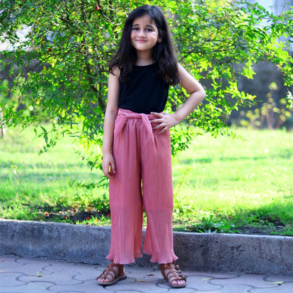 pink top with black palazzo